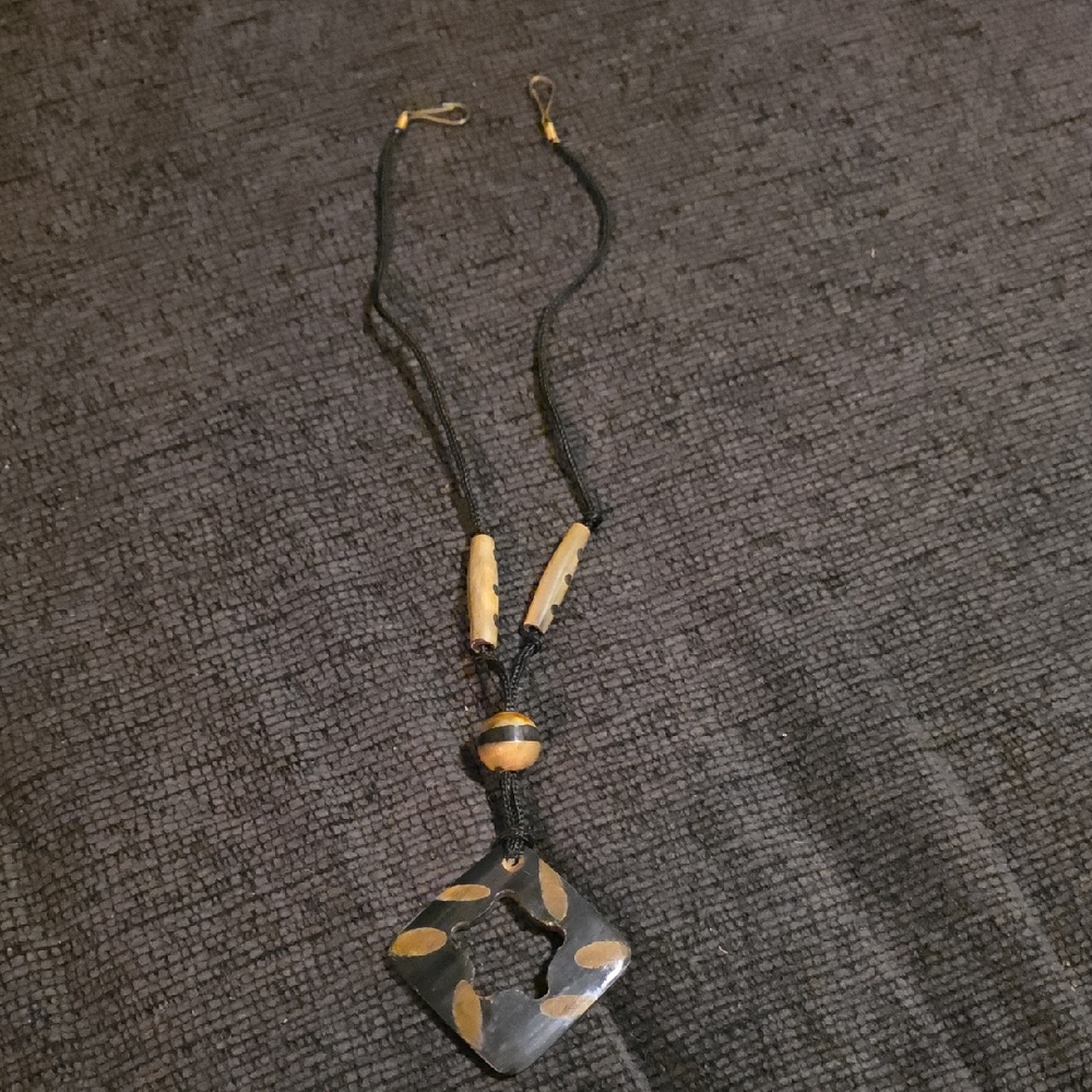 Elegant Black Necklace with Gold Accents